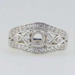 Sterling silver semi mount ring setting with round center for moissanite, surrounded by dazzling small stones.
