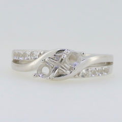 Sterling silver semi mount ring setting with round gemstone placeholder and channel-set accents.