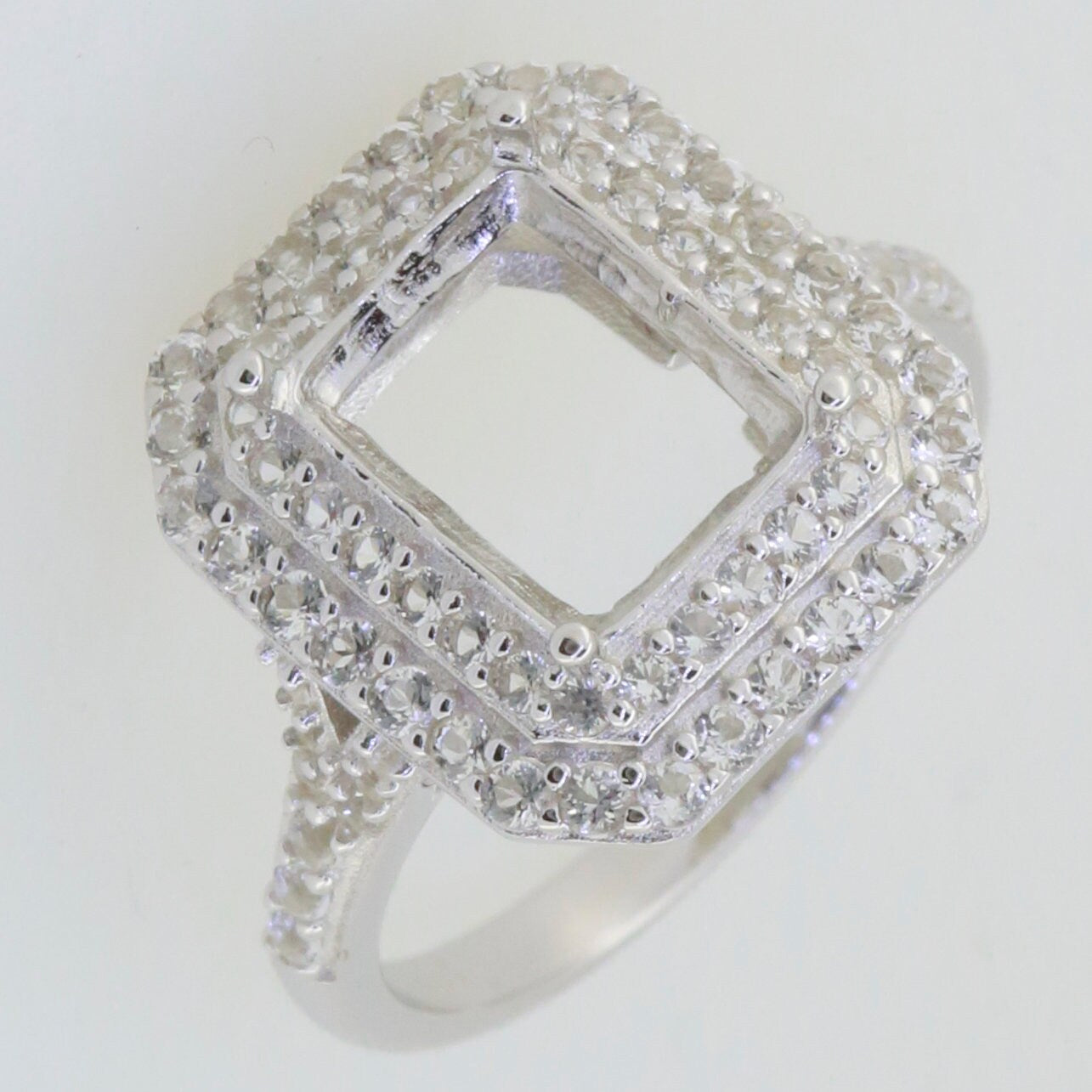 Sterling Silver semi mount ring setting with double halo design and white topaz gemstones, 10x8mm emerald stone placeholder.