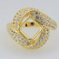 Gold ring with twisted design featuring sparkling stones and a square semi-mount centerpiece for custom gemstone setting.