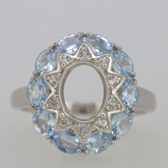 Sterling silver semi mount ring setting with oval opening and natural aquamarine halo gemstones.