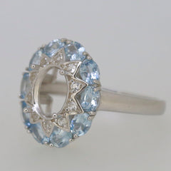 Sterling silver semi mount ring with an oval center and natural aquamarine halo, suitable for 9x7mm gemstones.