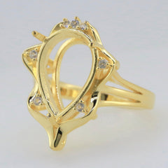 Gold semi mount ring setting featuring white topaz accents, perfect for a custom gemstone of your choice.