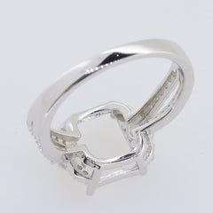 Sterling Silver semi mount ring setting with moissanite accents, designed for a 10x8mm oval emerald centerpiece.