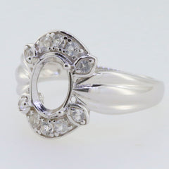 Sterling silver semi mount ring setting with oval halo and moissanite accent stones, designed for custom gemstones.