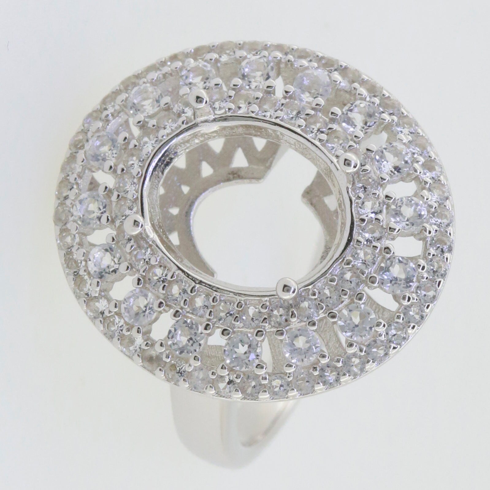 Sterling Silver Semi Mount Ring Setting with Triple Halo design for Oval gemstone, featuring White Topaz stone accents.
