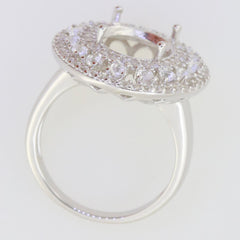 Sterling silver semi mount ring setting with triple halo design, prepared for an oval stone, showcasing white topaz accents.