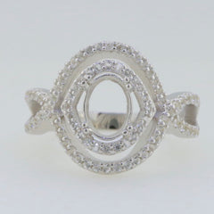 Sterling silver semi mount ring setting with oval design and split shank halo accent, ready for custom gemstone.