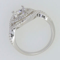 Sterling silver semi mount ring setting with oval halo and split shank design, showcasing white topaz accent.
