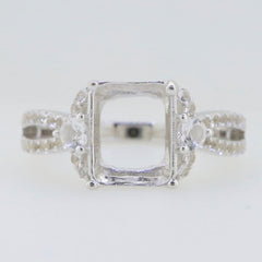 Sterling silver semi mount ring setting with moissanite accents and halo design, ideal for emerald gem placement.