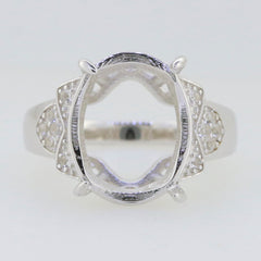 Sterling silver semi mount ring setting with oval halo design for 16x12mm gemstone, featuring white topaz accents.