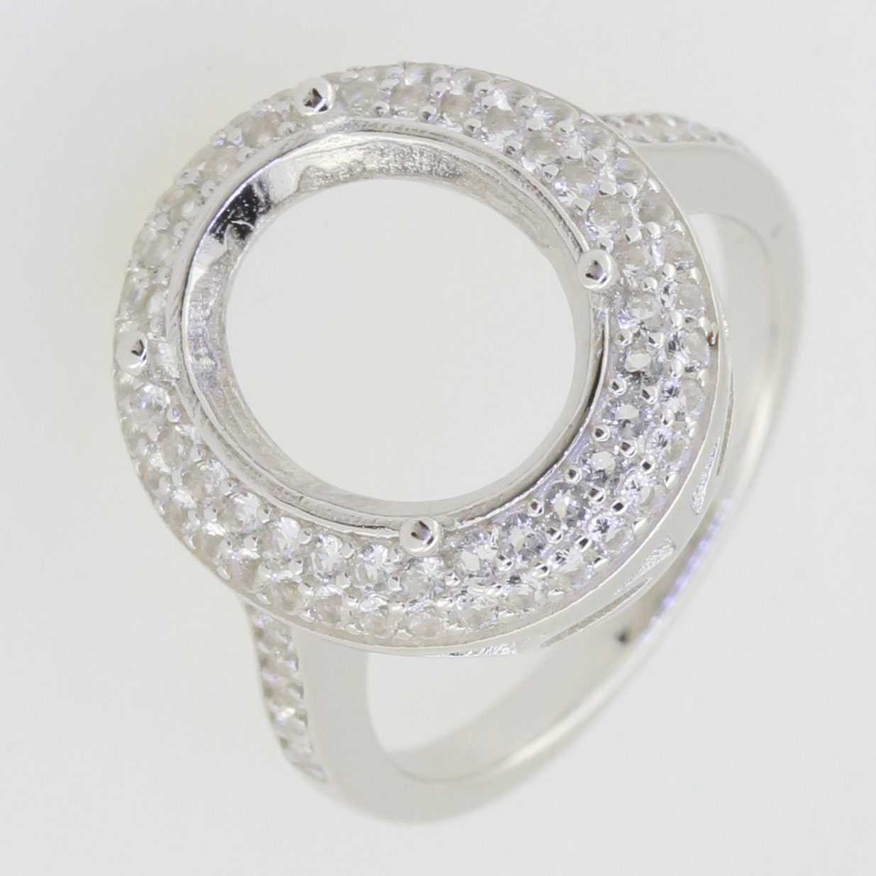 Sterling Silver Semi Mount Ring Setting featuring Oval Halo of White Topaz, designed for custom gemstone options.