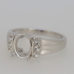 Sterling silver semi mount ring setting featuring oval placeholder and moissanite accents, customizable with various sizes.