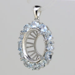 Sterling silver semi mount pendant setting featuring an oval halo design with aquamarine gemstones.