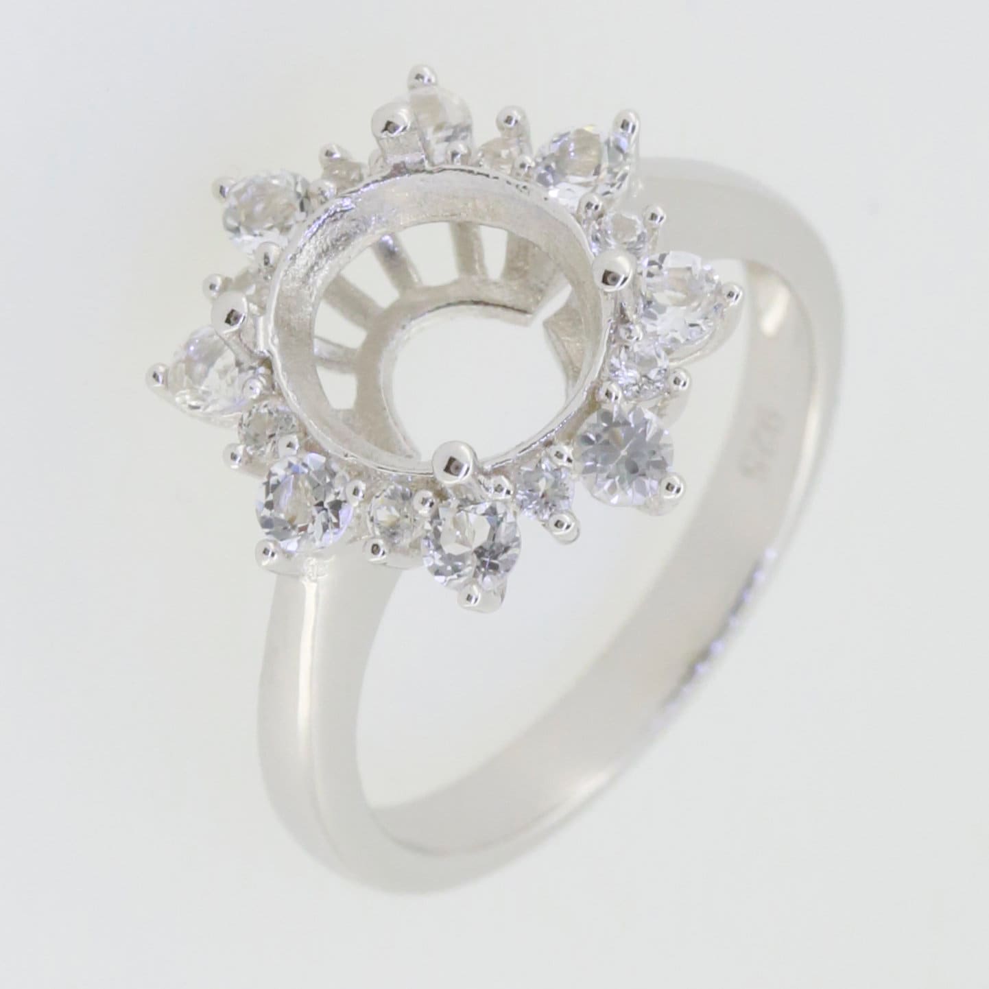 Sterling silver semi mount ring setting featuring an oval 10x8mm halo with moissanite accents.