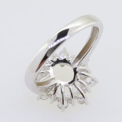 Sterling silver semi mount ring setting for 10x8mm oval stone with moissanite accents, showcasing intricate design.