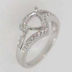 Sterling silver semi mount ring setting with halo and moissanite accents, designed for a 7x7mm trillion gemstone.