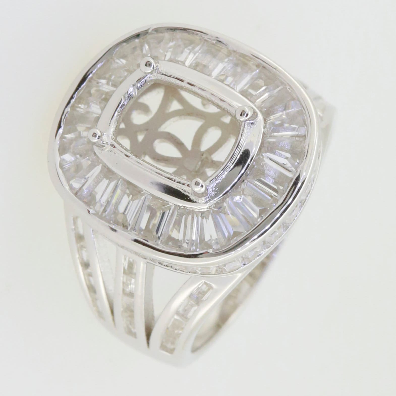 Sterling silver semi mount cocktail ring setting with cushion halo and baguette accent stones.