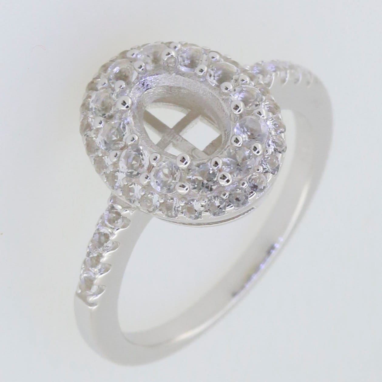 Sterling Silver Semi Mount Ring Setting with White Topaz gemstones, featuring an oval design for an 8x6mm main gemstone.