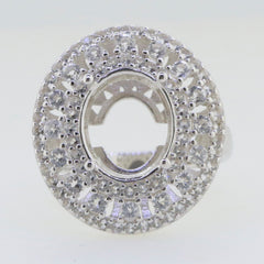 Sterling silver semi mount ring setting with triple halo design, featuring space for an oval stone and accent white topaz.