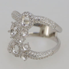 Sterling silver semi mount ring setting with oval and round openings, featuring a double row split shank halo.