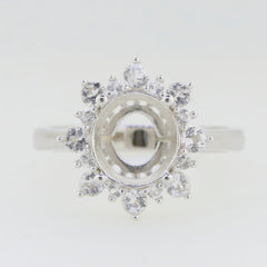 Sterling silver semi mount ring setting with halo and moissanite accents, designed for 10x8mm oval gemstones.