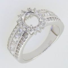 Sterling silver semi mount ring setting with halo and moissanite accents for 8x6mm oval gemstone.