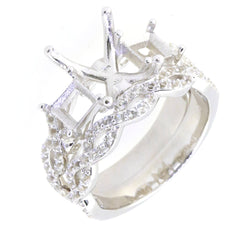 Sterling silver semi mount ring setting with swirling cross shank and moissanite detailing, perfect for engagement.