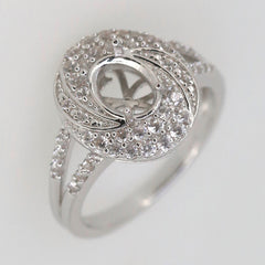 Sterling silver semi mount ring setting with oval design, split shank halo, and white topaz accents.