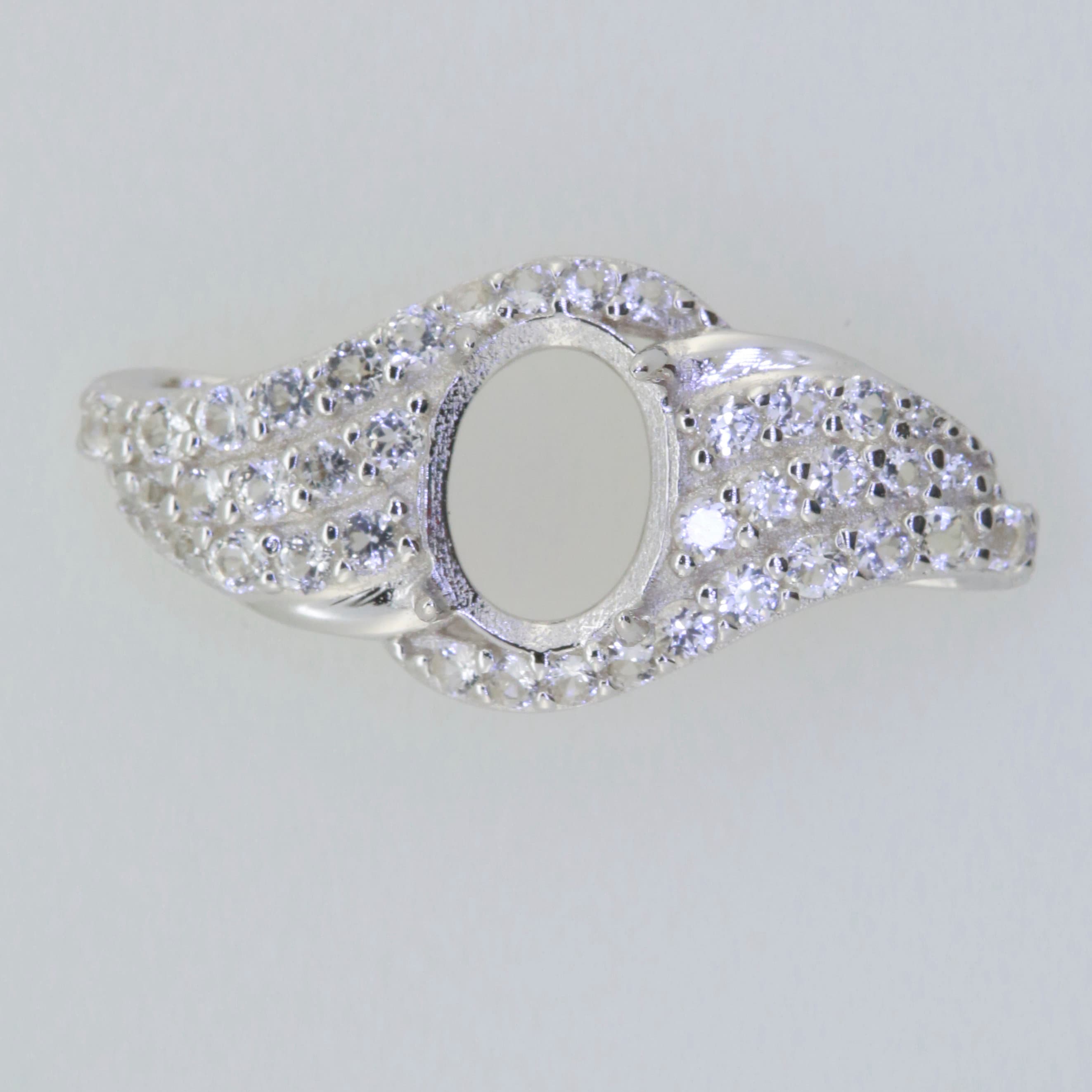 Sterling Silver Semi Mount Ring Setting with White Topaz halo, oval center for gemstone placement.