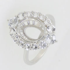 Sterling silver semi mount ring setting with halo of moissanite accents, designed for a 9x7mm oval gemstone.