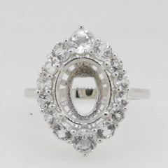 Sterling silver semi mount ring setting with oval halo and moissanite accents, designed for custom gemstone sizes.