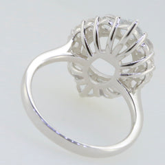 Sterling silver semi mount ring setting with halo design for 9x7mm oval gemstones and moissanite accents.