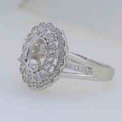 Sterling silver semi mount ring setting with double halo for oval gemstone, featuring white topaz accents.