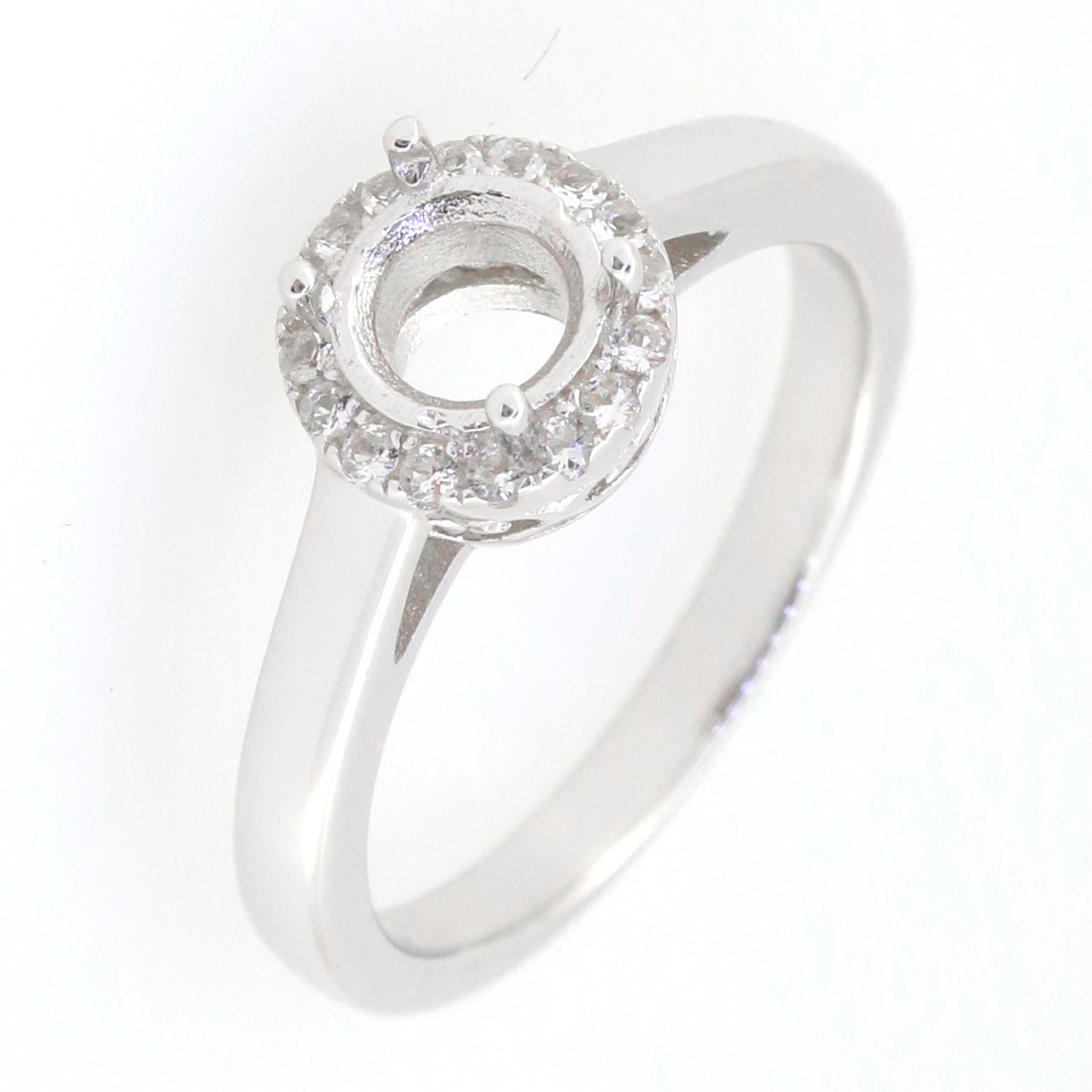 Sterling silver semi-mount ring setting, round halo with Moissanite accents, designed for custom gemstone options.