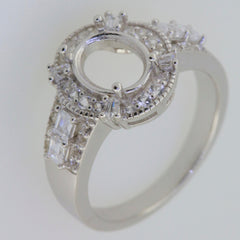 Sterling silver semi mount ring setting with oval halo and baguette stones, designed for customizable gemstones.