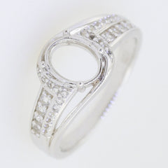 Sterling silver semi mount bypass ring setting with moissanite accents for 8x6mm oval gemstone.
