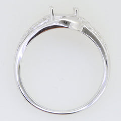 Sterling silver semi mount ring setting with moissanite accents, designed for an oval gemstone, shown from the side.