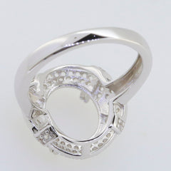 Sterling Silver Semimount Ring Setting for Oval Stone, featuring White Topaz Accents, ready for custom gemstone placement.