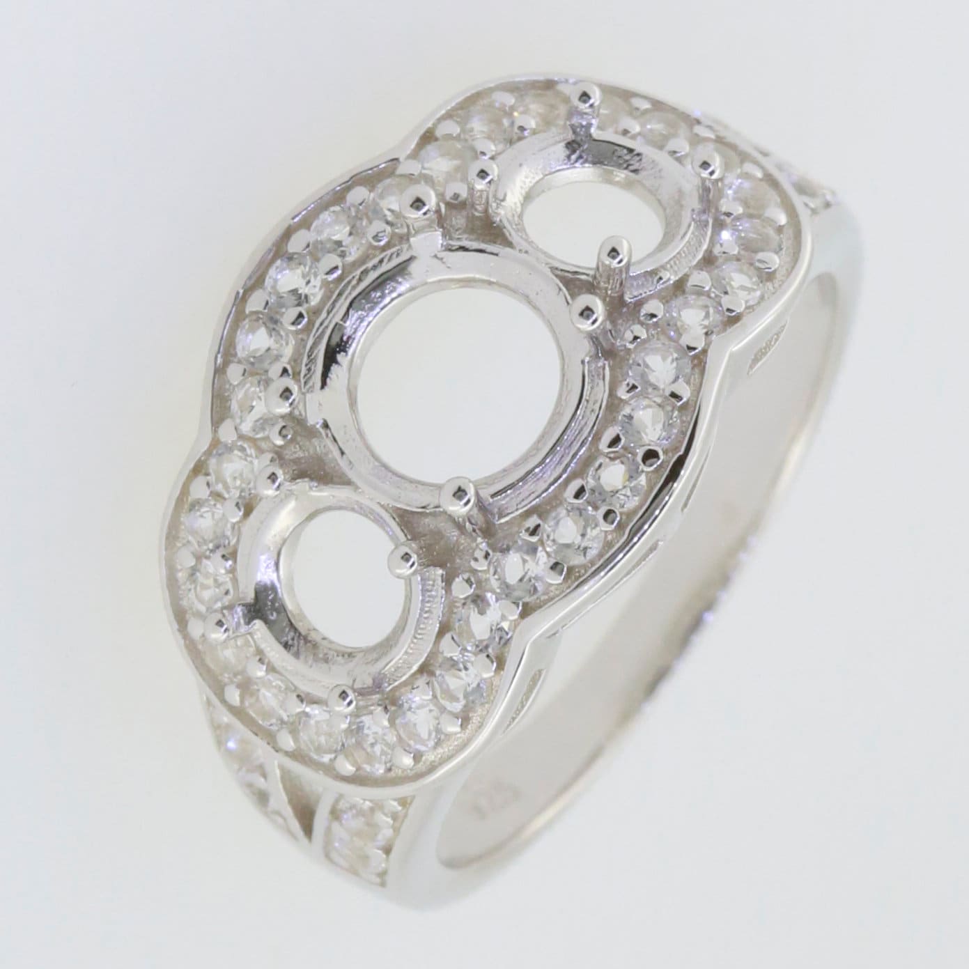 Sterling silver semi mount ring setting with Moissanite accents, featuring three round settings for gemstones.