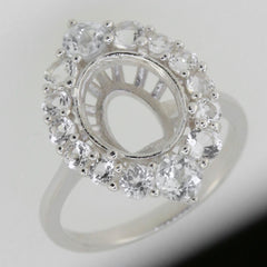 Sterling silver semi mount ring setting with halo of moissanite stones, designed for 9x7mm oval gemstone.