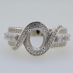 Sterling Silver Twisted Shank Semi Mount Ring Setting with Oval Halo for 8x6mm Gemstone and White Topaz accents.