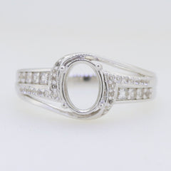 Sterling silver semi mount ring setting with oval stone space and moissanite accent gemstones for custom jewelry.