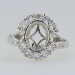 Sterling silver semi mount ring setting with moissanite accents, featuring an oval center and halo design.