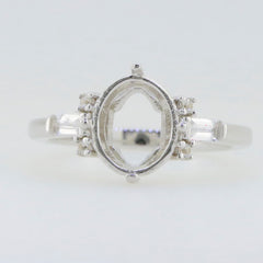 Sterling silver semi mount ring setting featuring oval 10x8mm with baguette accent, unembellished for custom gemstone setting.