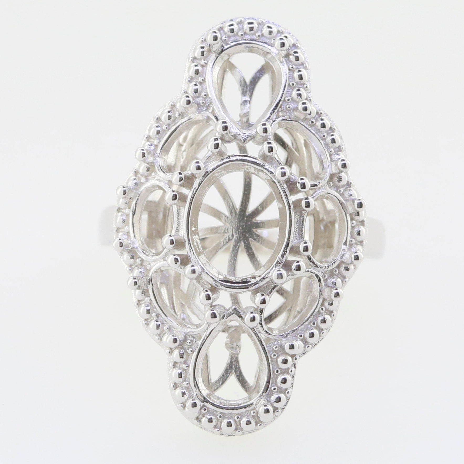 Sterling silver semi mount ring setting featuring intricate design for oval gemstones, customizable and made to order.