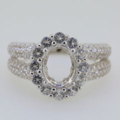 Sterling silver semi mount ring setting with oval center and halo of white topaz, split shank design.