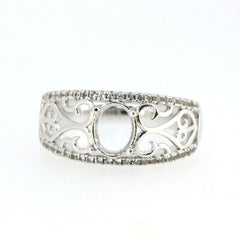 Sterling silver semi mount ring setting with filigree design and topaz accent, oval stone placeholder.