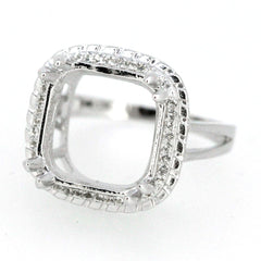 Sterling silver semi mount ring setting with halo design, featuring a square center for emerald and white topaz accents.