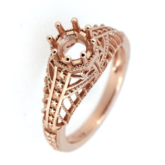 Rose gold semi mount ring setting with intricate Art Deco design for a round gemstone.